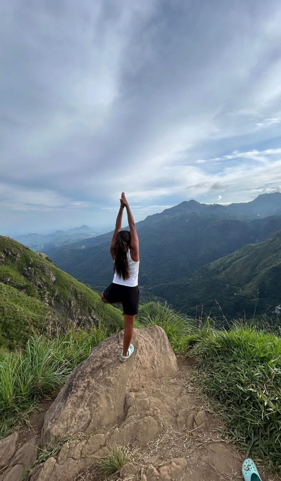 Tree pose on a mountain ridge