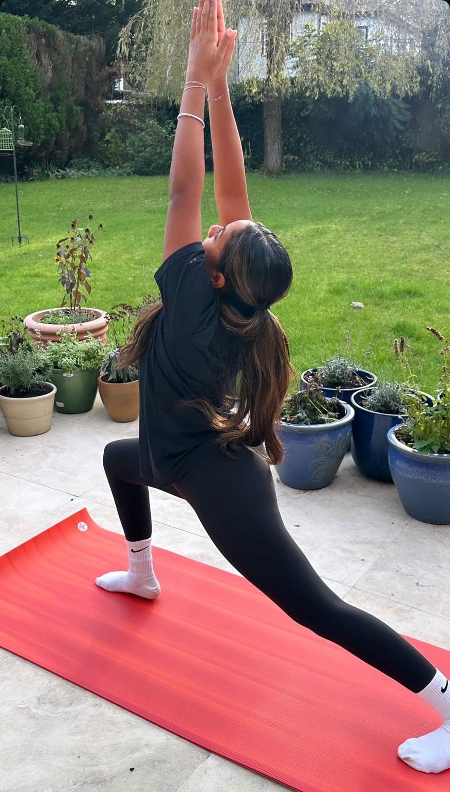 Reverse warrior practice at home on a patio