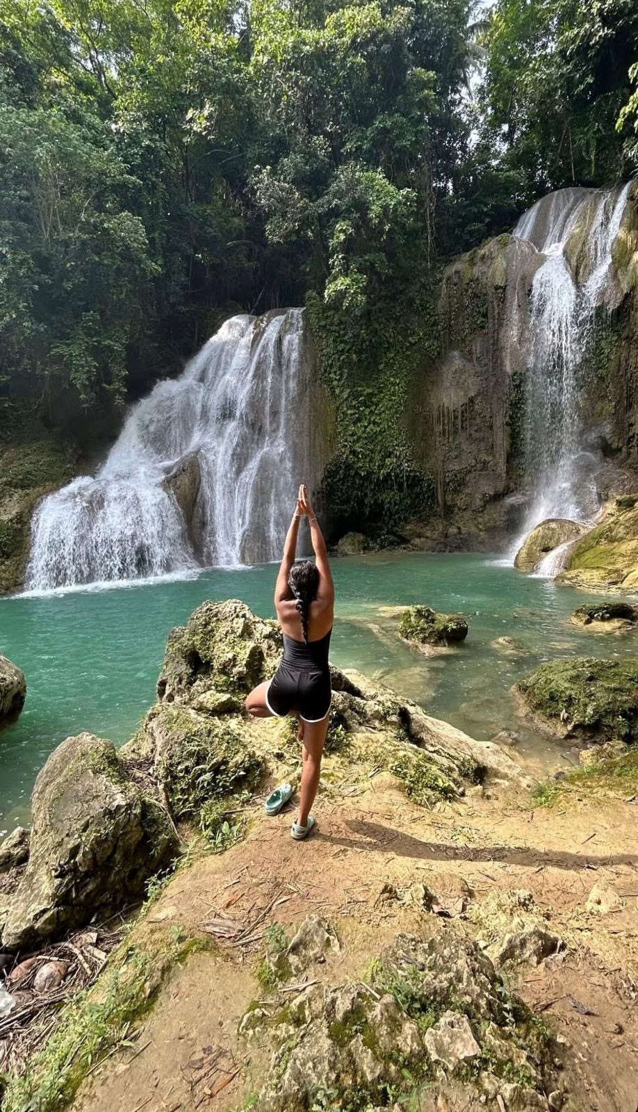 Tree pose in front of waterfalls